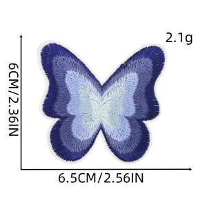Macro detail of gradient blue butterfly embroidered patch showing size and texture
