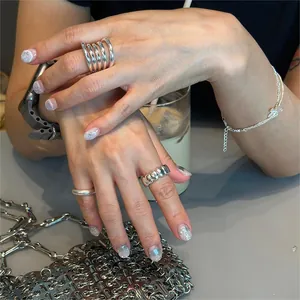 S925 sterling silver oval rings set with butterfly pendant bracelet on model hands