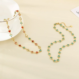 Detail of gold necklaces with colorful heart glass gems and S925 engraved clasp