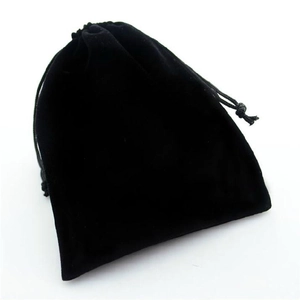 Minimalist black velvet drawstring jewelry pouch with soft texture on white background
