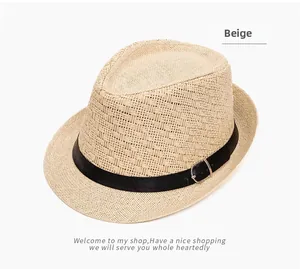 Close-up of beige woven straw hat texture with black ribbon and silver metal buckle detail