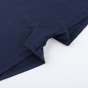 Detailed close-up showing the reinforced stitching and elastic dark blue knit fabric