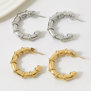 Minimalist C-shape stainless steel earrings in gold and silver with bamboo segment design