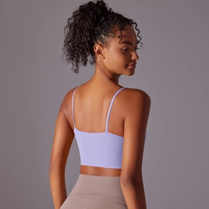 Detail view of lavender yoga tank top featuring thin straps and sexy open back design
