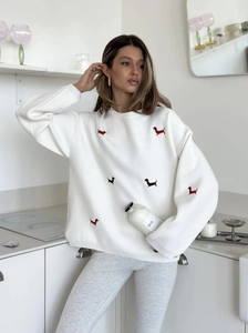 White crewneck knit sweater featuring cute dachshund embroidery in a loose casual style
