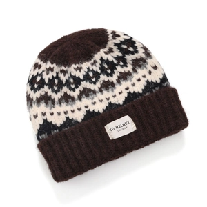 Macro detail of Fair Isle knit pattern and brushed texture on the vintage beanie