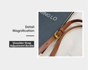 Detail of brown leather strap with adjustable gold metal buckle on a shoulder bag
