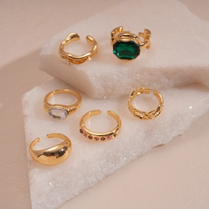 Vintage 6-piece gold ring set with emerald and rhinestones on white stones