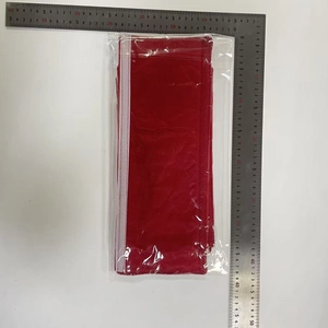 Detail shot of red Christmas door handle cover size 40cm by 13cm in transparent packaging