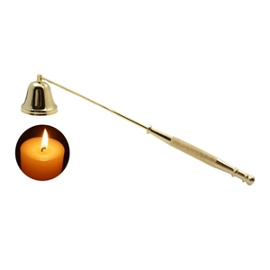 Detailed view of golden bell-shaped candle snuffer with textured handle on white background