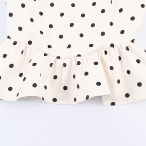 Chic beige polka dot sleeveless top with ruffled hem and slim waist for women