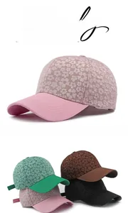 Close-up of floral jacquard fabric and structured brim on this women's baseball cap