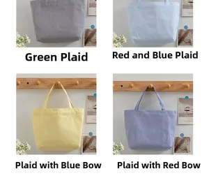 Detailed close-up of seersucker tote bags in four vibrant striped colors for daily use