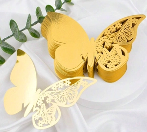 Detailed view of 3D gold butterfly wall stickers with intricate laser-cut hollow patterns