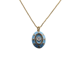 Macro shot of 18K gold plated evil eye pendant with blue enamel and colorful zircons