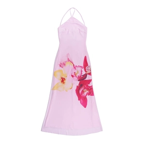 Detail of pink backless halter dress showing orchid floral pattern and silky fabric texture