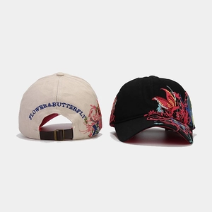 Detail of high-density cotton baseball cap with intricate butterfly floral embroidery
