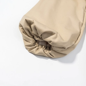 Close-up of the khaki elastic cuffs and premium fabric texture on the winter coat