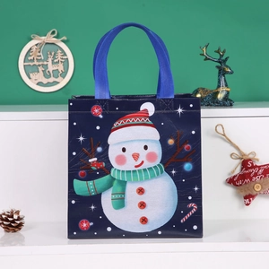 Blue Christmas non-woven gift bag featuring a cute snowman pattern with blue handles