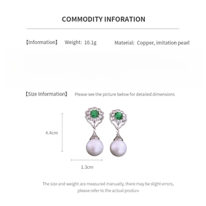 Size details of vintage earrings featuring green stones and drop pearls with copper base