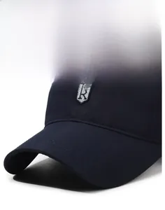 Close-up of the stiff brim and embroidered shield logo on this dark blue baseball cap