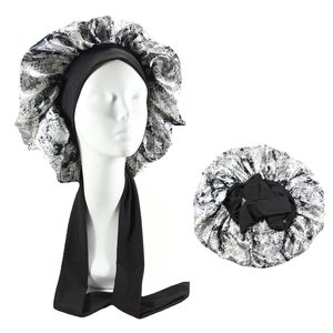 Detail of satin sleeping turban with camouflage print and adjustable long black ties