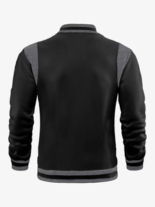 Back view of a casual varsity jacket with black and grey patchwork and ribbed details