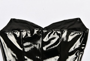 Close-up of the black glossy PU leather neckline with high-quality stitching detail