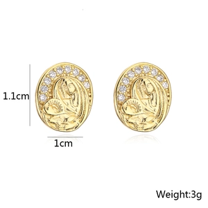 Detailed view of 18K gold plated oval stud earrings with Virgin Mary relief and zircons
