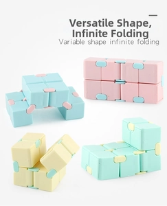 Macro view of infinity cube in four colors showing flexible infinite folding mechanism