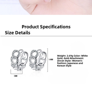 Detail view of chain link hoop earrings with white zircon stones measuring 14mm by 5mm