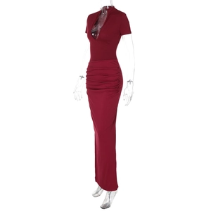 Detail view of wine red bodycon maxi dress with deep V-neck and ruched side draping