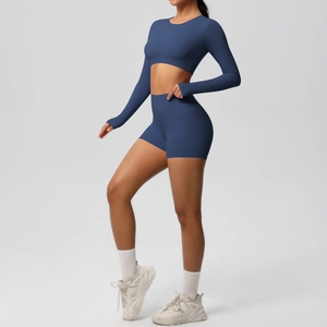 Detailed side view of navy blue high-waisted seamless yoga shorts and cropped top set