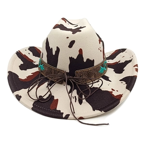 Western cowboy hat with black and white cow print and turquoise embroidered band