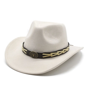 Detail of western cowboy hat featuring leather band and bronze bull head metal emblem
