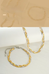 Detailed close-up of woven tricolor stainless steel necklace and bracelet set