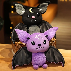 Adorable black and purple devil bat plush dolls with moon and star icons in a basket