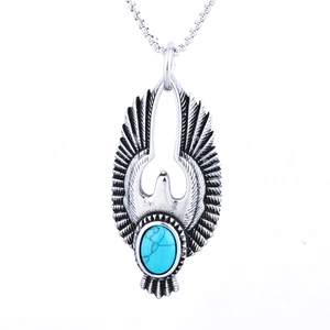 Eagle pendant necklace in stainless steel with blue turquoise gemstone on white background