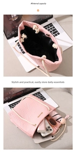 Detailed interior of a pink quilted tote bag showing large capacity and rope handles