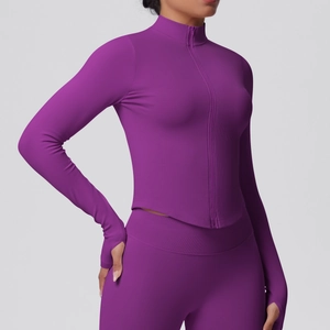 Detail view of purple yoga jacket featuring vertical ribbed texture and thumbhole cuffs