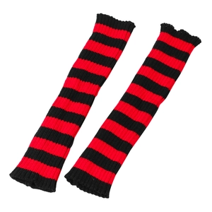 Detailed knit texture of red and black striped punk leg warmers on a white background