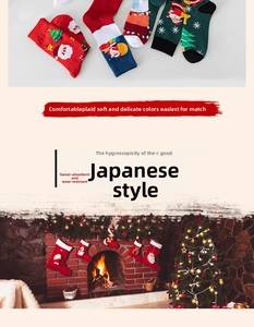 Close-up of festive Christmas socks with Santa and tree patterns in holiday colors