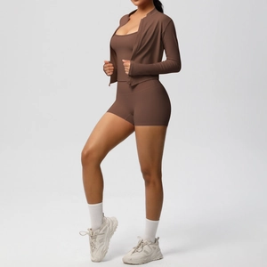 Three-piece brown yoga set with zip jacket, sports bra and high-waist shorts for fitness