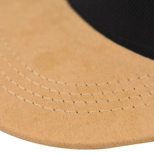 Close-up of stitching details and fabric texture on a Brooklyn style baseball cap brim