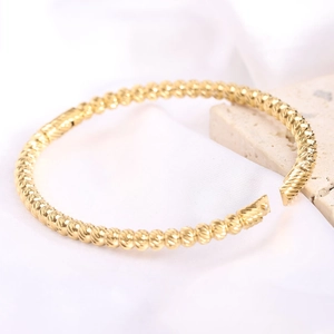 Minimalist 5mm gold stainless steel open bangle with refined spiral texture design