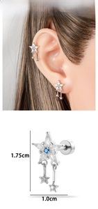 Detailed view of silver star tassel earrings with blue gemstone and white zircon stones
