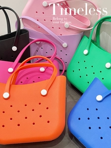 Detailed view of colorful EVA tote bags with decorative holes and matching handles