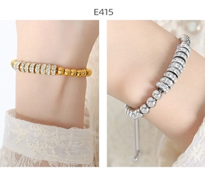 Detail of adjustable beaded bracelet with sparkling rhinestones in gold and silver