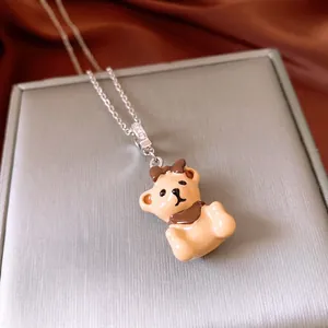Adjustable silver necklace with brown enamel bear pendant and sparkling zircon details