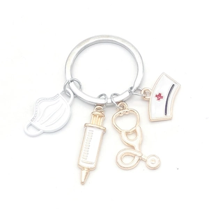 Medical themed keychain with nurse cap stethoscope syringe and face mask charms